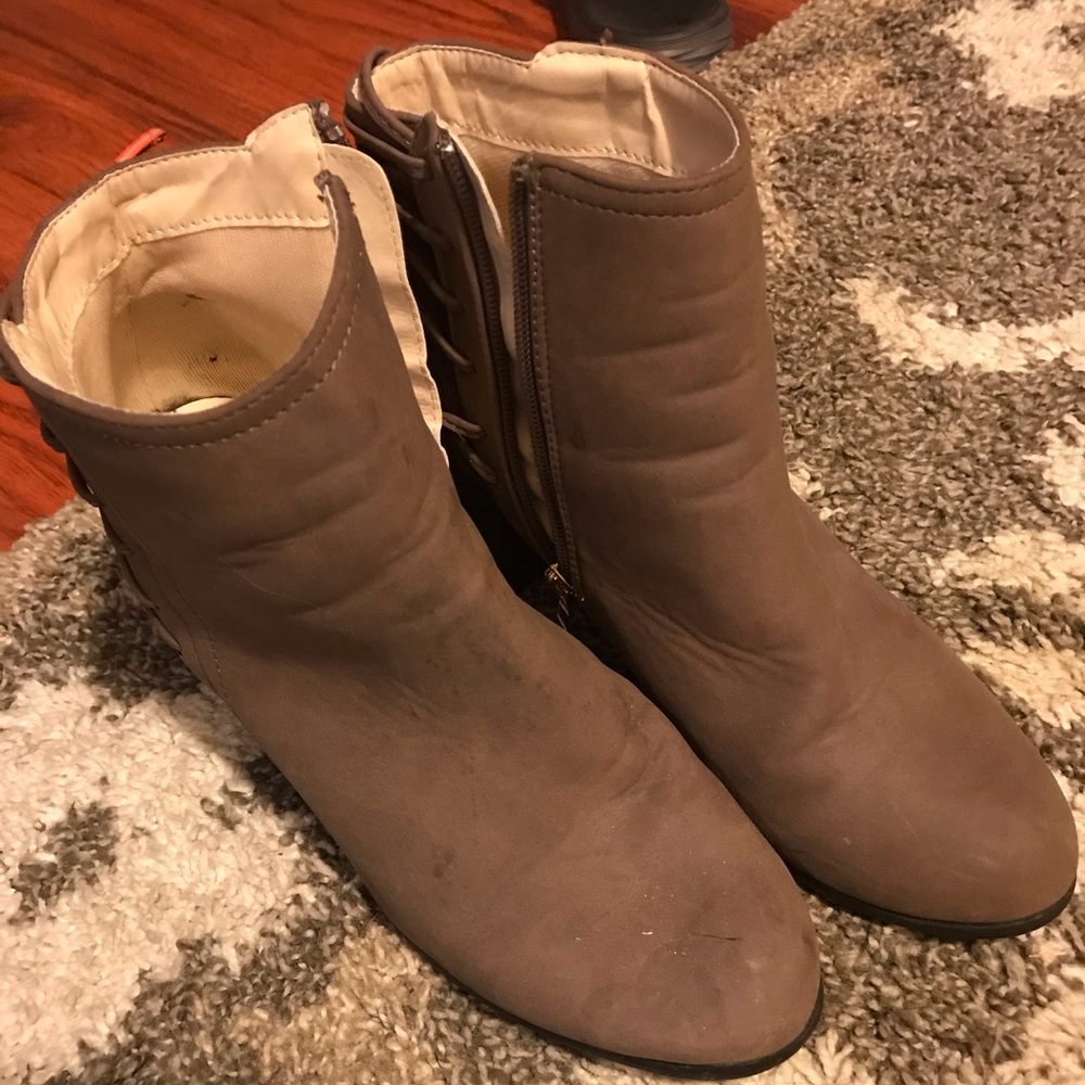 Tan booties with heal details.